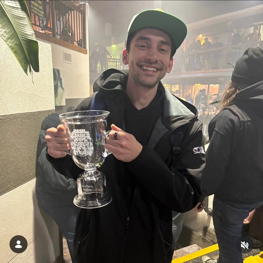 CannaDave holding the 2026 Hash Bash Cup first-place sativa trophy for Bangarang strain