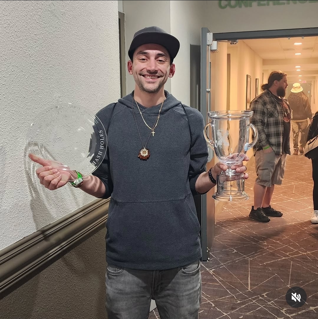 CannaDave holding Hash Bash Cup awards during the Bangarang strain three-peat